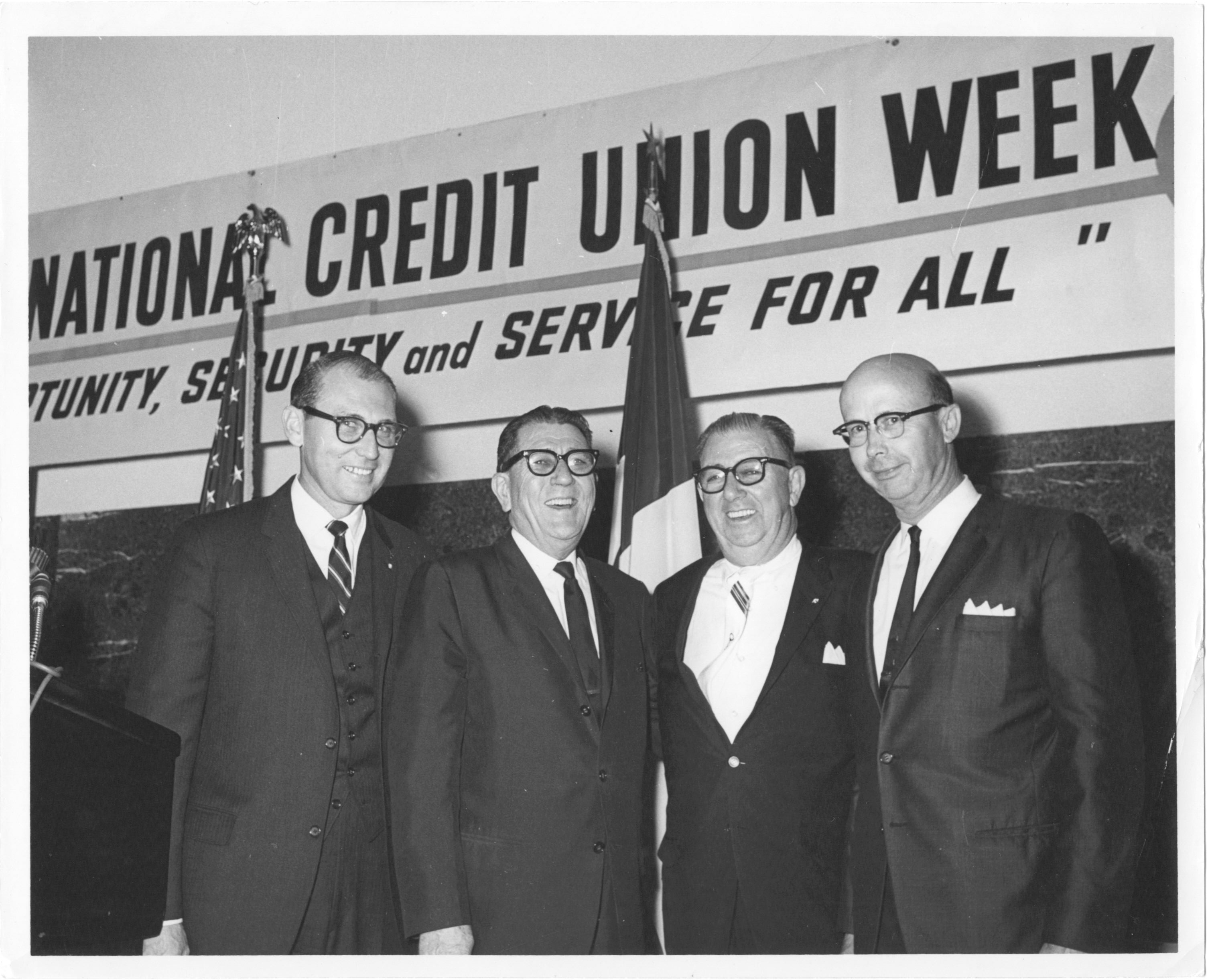 Group of men in suits and ties and glasses